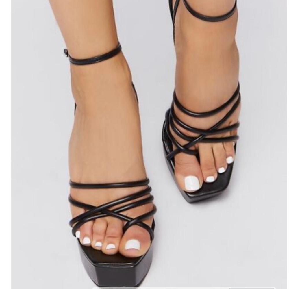 A pair of faux leather platform heels size 8 never been worn.
